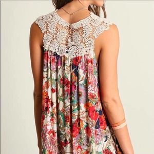 Umgee floral crochet tunic dress in a medium. It flows and swings so nicely. Fun